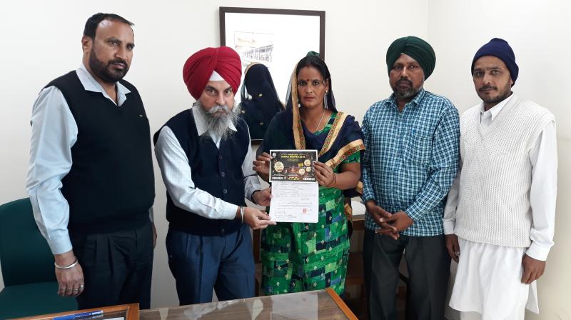 First prize winners presenting their documents to claim the prize of Punjab State Diwali Bumper-2018