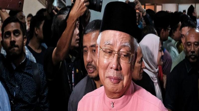 Defeated Malaysian leader Najib Razak resigns from his party