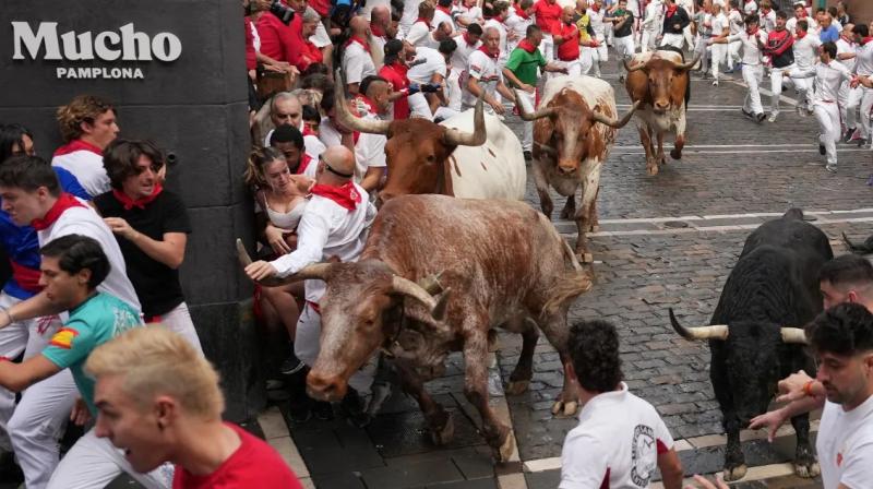 Thousands Run with Bulls at San Fermín Festival's Opening Event in Spain