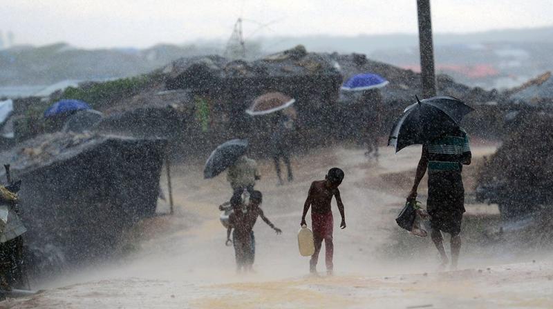 First monsoon rains pound Rohingya camps