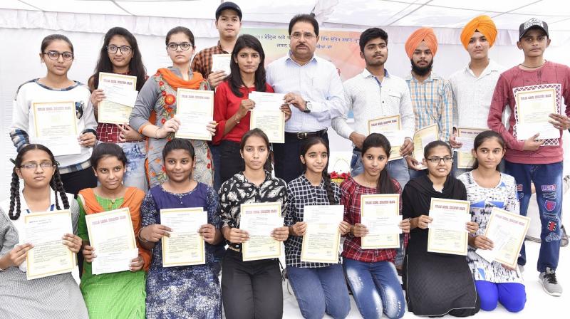 O.P Soni with the matric and 10+2 meritorious students of PSEB 2018 Exams