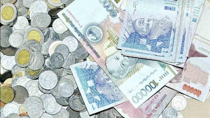 Rupee gained 13 paise to trade at 66.77 against the US Dollar