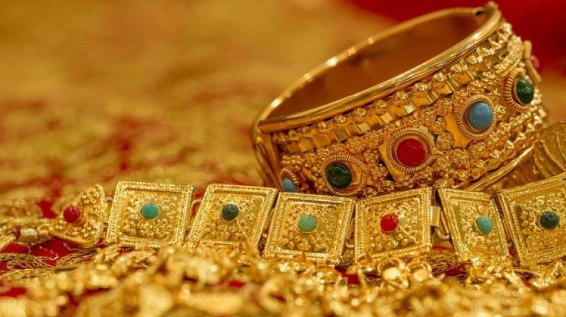 Gold slips on fall in demand