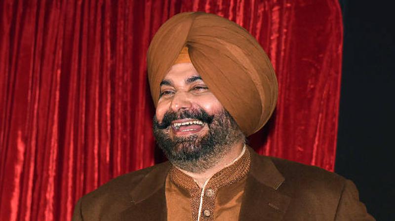 Known for his signature “Thoko Taali!” catchphrase, Sidhu resumes his iconic special-guest chair alongside long-time co-panellist Archana Puran Singh after a notable absence.File Photo.