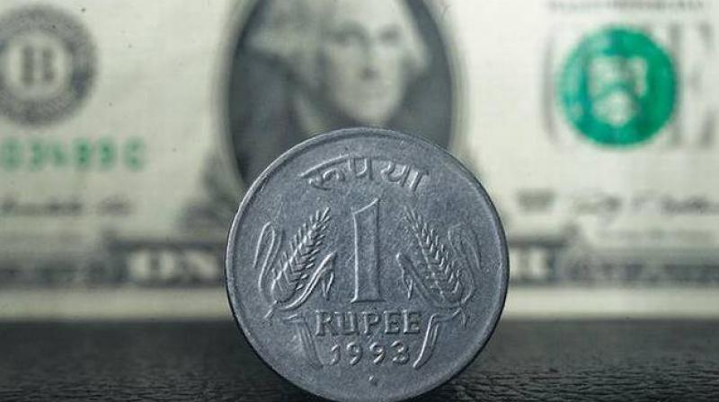 Rupee slides 16 paise against dollar