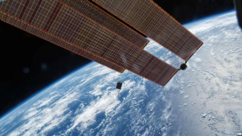 Titanium plates that will be loaded onto a tiny satellite