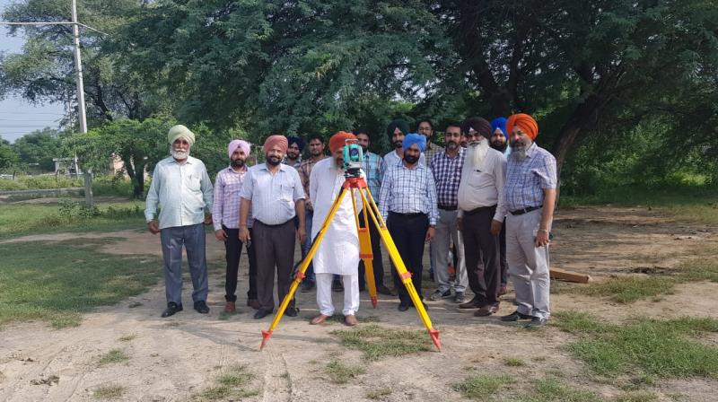Punjab Revenue Department officials demarcating a land with Theodolite machine