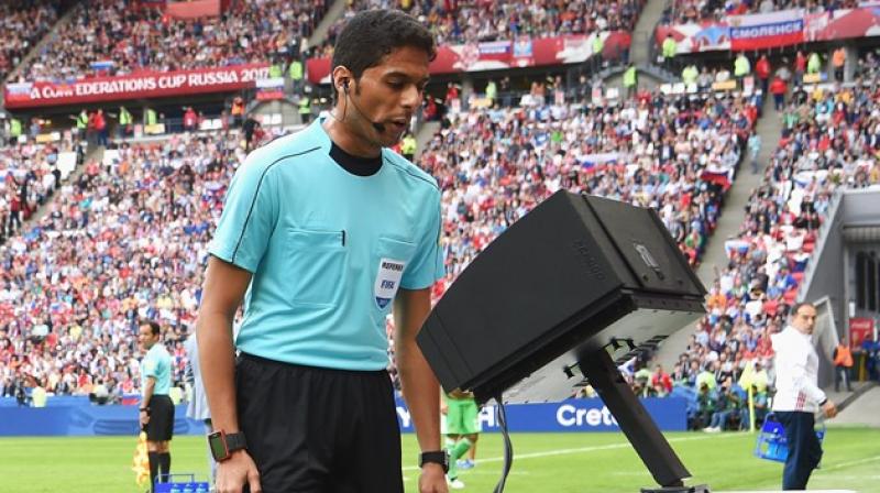 Football referees watching slow motion videos