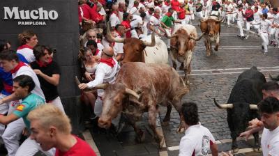 Thousands Run with Bulls at San Fermín Festival's Opening Event in Spain