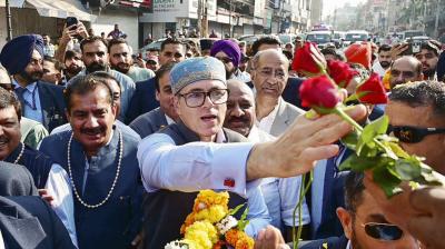 Jammu and Kashmir Chief Minister Omar Abdullah receives flowers as he arrives on the resumption of the biannual 'Darbar Move' after a gap of four years, in Jammu, Monday, Nov. 3, 2025. The 'Darbar Move' involves shifting the Jammu and Kashmir government's offices between Srinagar and Jammu with the changing seasons.