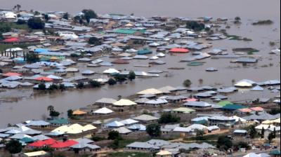Severe flooding left about 100 people dead across 10 states