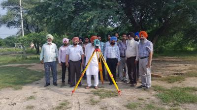 Punjab Revenue Department officials demarcating a land with Theodolite machine