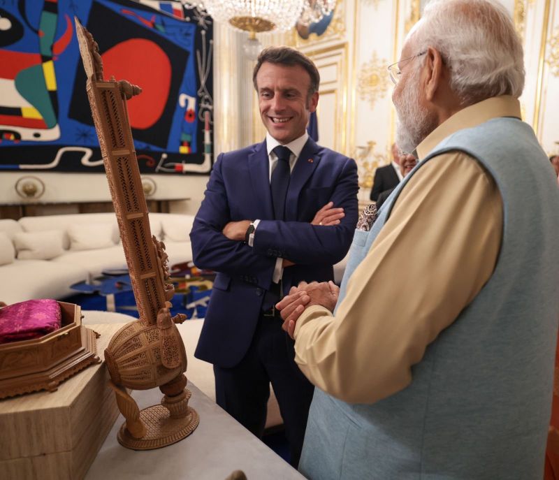 PM Narendra Modi presented a Sitar made of sandalwood to French President Emmanuel Macron as a gesture of friendship and cultural exchange. President Macron's wife, Brigitte Macron was also presented with a sandalwood box and other items.
