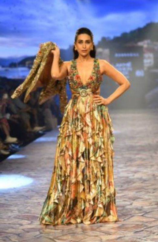 Actress wore a floral dress with frills and a glorious jacket 
