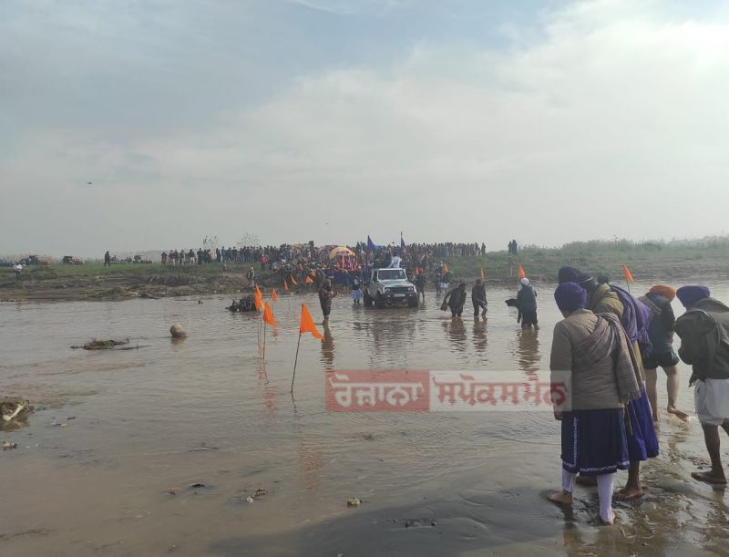 Devotees Cross Sarsa River with Reverent Chants of "Satnam Sri Waheguru"