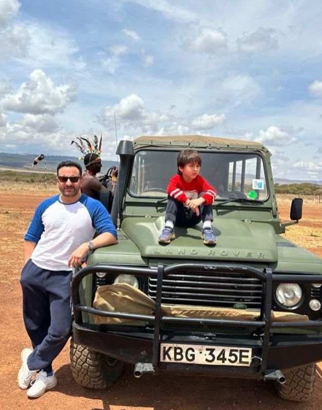 Saif Ali Khan and Taimur Ali Khan posing with Land Rover 
