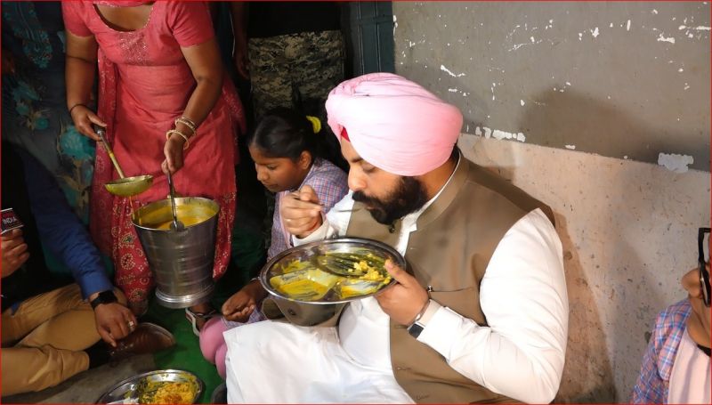 Harjot Singh Bains Sits on floor and eats Midday Meal with Children 
