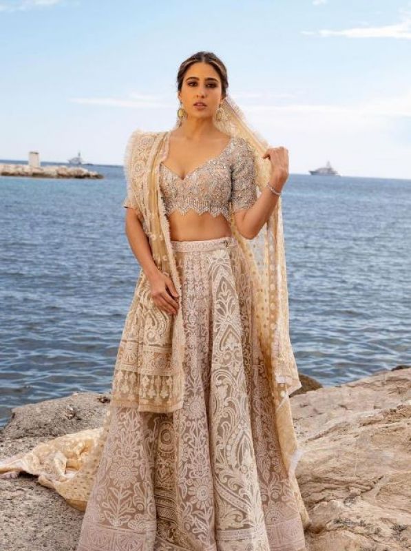 Sara Ali Khan made her Cannes red carpet debut in an ivory Abu Jani Sandeep Khosla lehenga