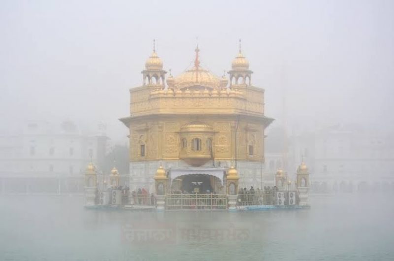 Golden Temple Embraced by Fog Blanket, Unveiling a Serene Spectacle
