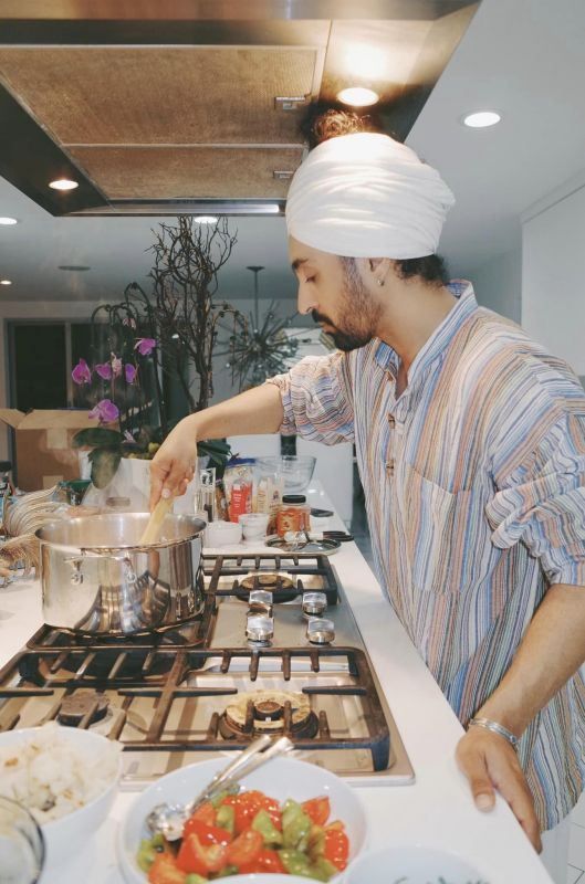 Celebrity Singer Diljit Dosanjh Exhibits 'Chamkila' Vibes While Creating Yummy Delights