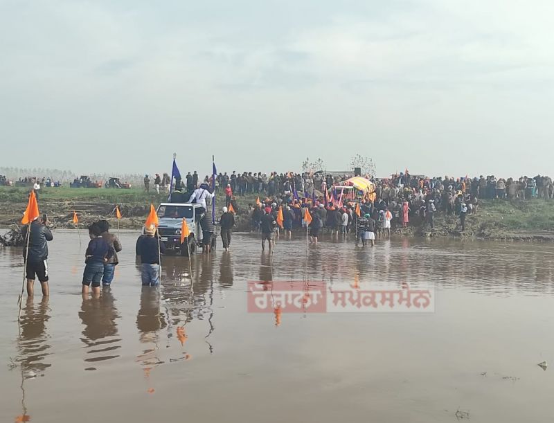 Devotees Cross Sarsa River with Reverent Chants of "Satnam Sri Waheguru"