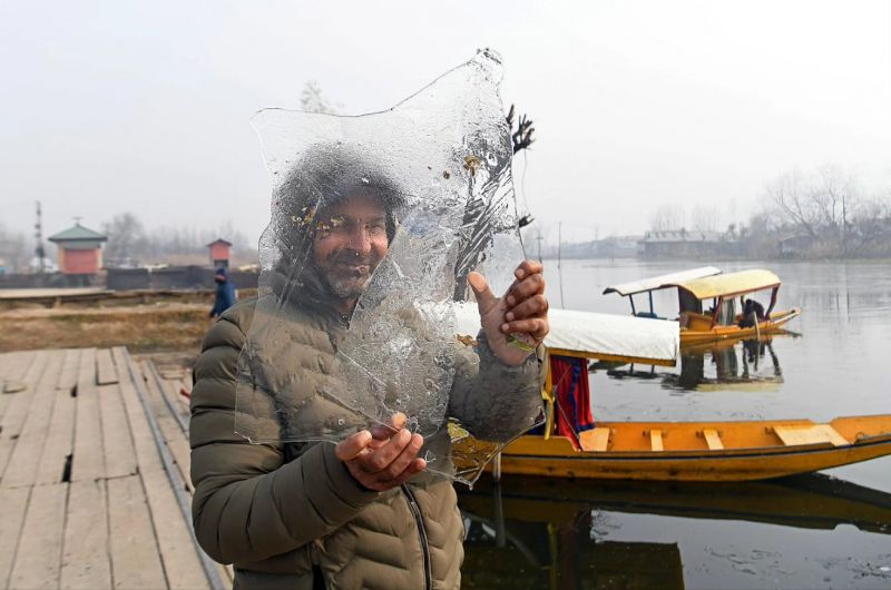 Dal Lake Freezes Over as Kashmir Grapples with Bone-Chilling Cold