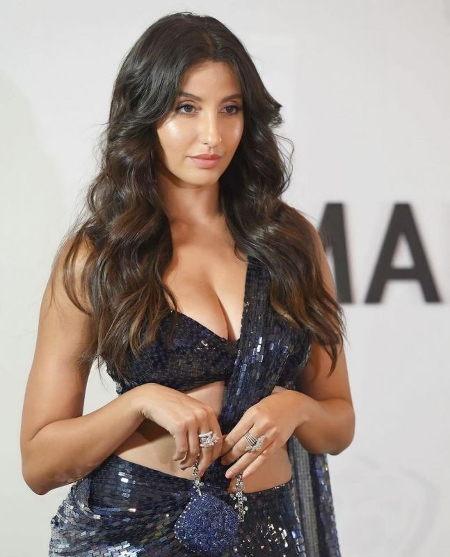 Nora Fatehi's Show-Stopping Saree Look Shines at the Manish Malhotra Fashion Extravaganza
