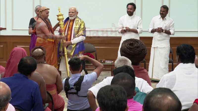 Chief Mahant of Madurai Adheenam Temple, Adheenam Harihar Das Swamigal hands over 'Sengol' to PM Modi which will be installed in the New Parliament Building  

