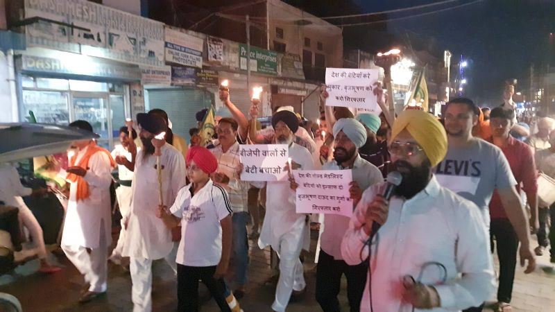 Members of BKU Shaheed Bhagat Singh organized a torch march at the historic Jagadhri Gate of Ambala in support of wrestlers
