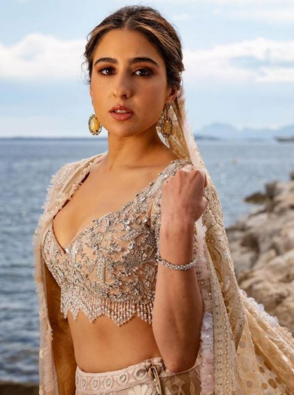 Sara Ali Khan made her Cannes red carpet debut in an ivory Abu Jani Sandeep Khosla lehenga