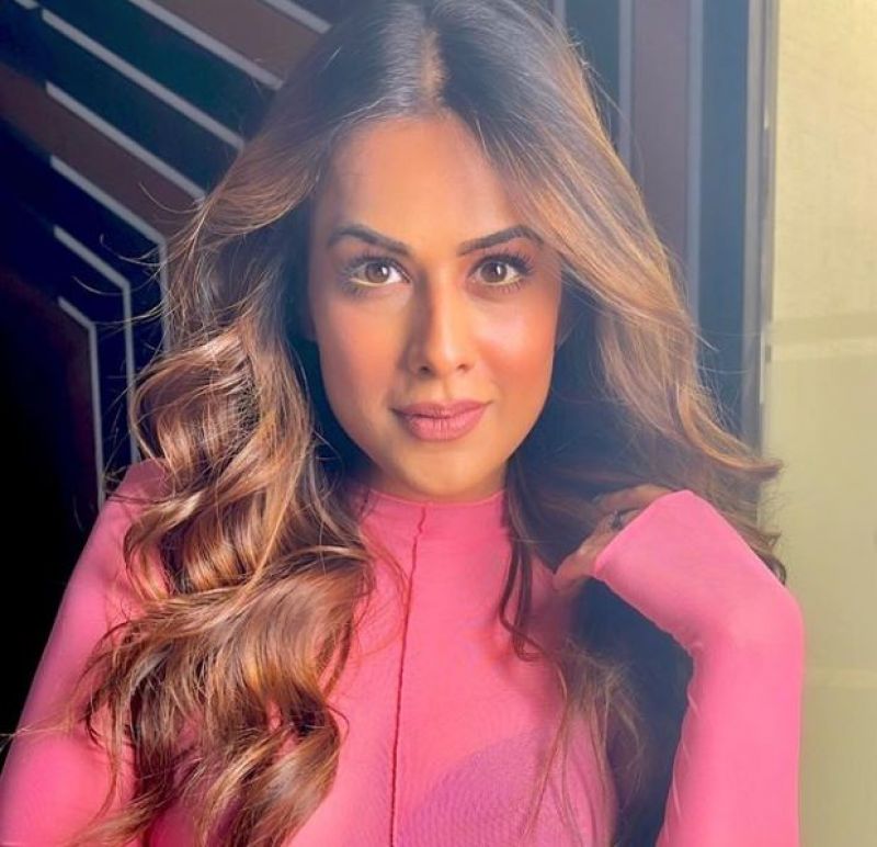 Nia Sharma glitters in Pink Attire with Wavy Loose Hair
