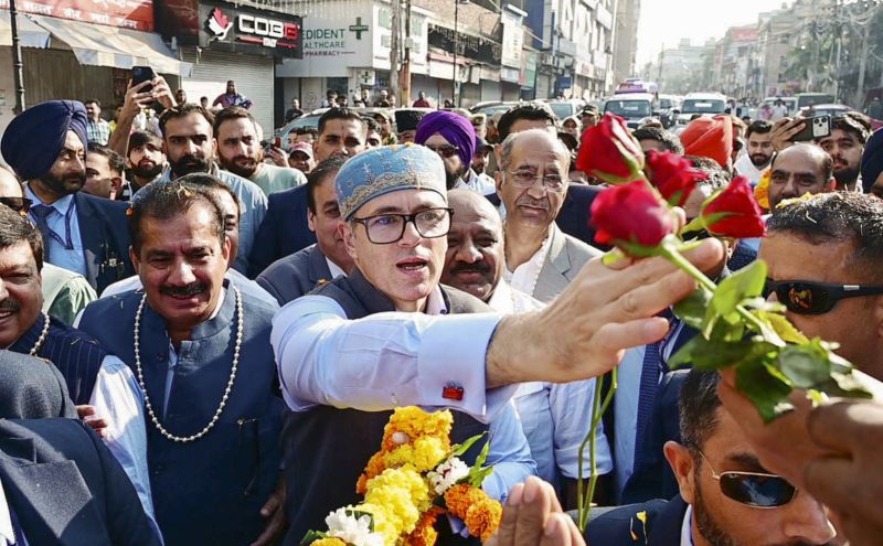 Jammu and Kashmir Chief Minister Omar Abdullah receives flowers as he arrives on the resumption of the biannual 'Darbar Move' after a gap of four years, in Jammu, Monday, Nov. 3, 2025. The 'Darbar Move' involves shifting the Jammu and Kashmir government's offices between Srinagar and Jammu with the changing seasons. (PTI Photo)